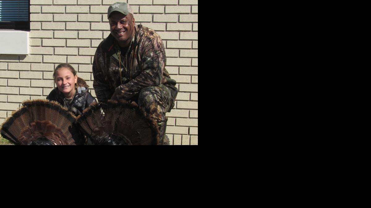 
Ashley Bellavance, 10, with Chester County Sheriff Alex Underwood and the two turkeys she bagged during the sheriff's office youth hunt Saturday in Chester.
