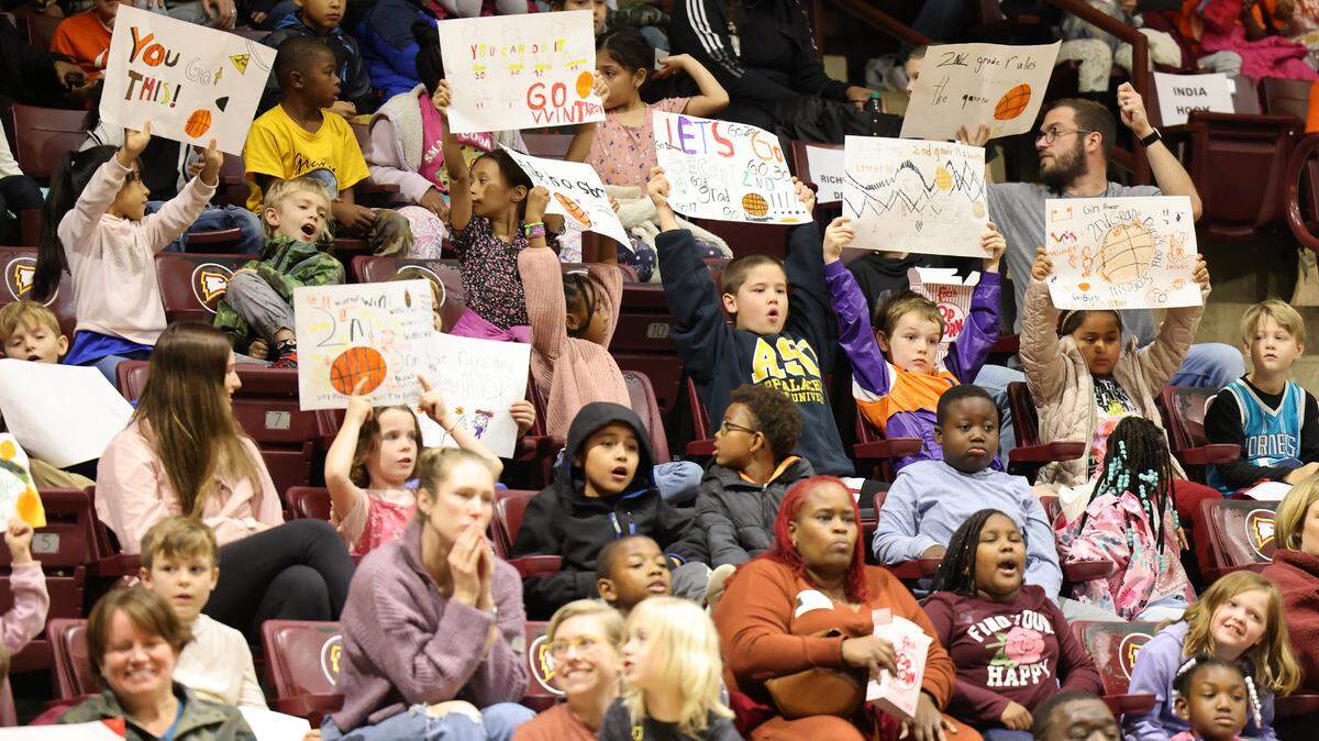 In this file photo, second graders from the Rock Hill School District cheer for the Winthrop women’s basketball team at the Coliseum. District enrollment is dwindling, new numbers show.