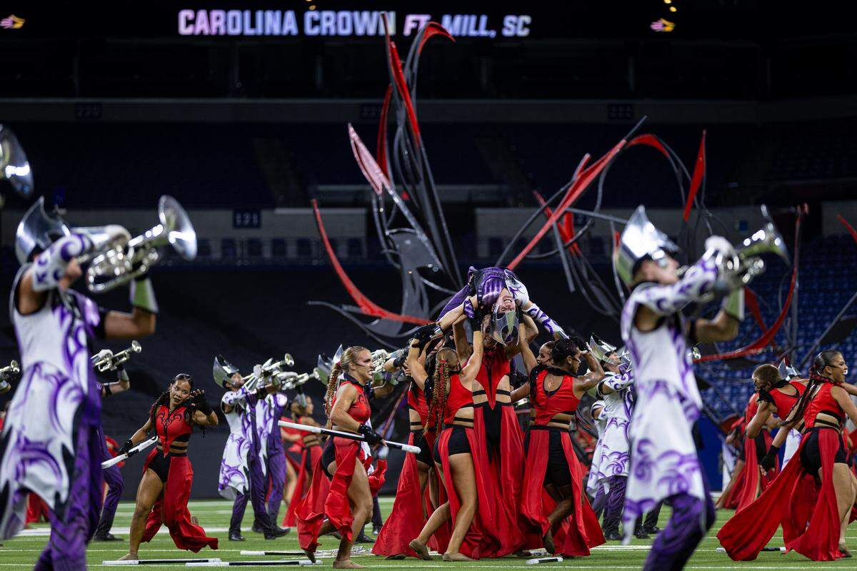 Brass and color guard performers with Fort Mill-based Carolina Crown perform in early August at the DCI World Championships. Carolina Crown finished fifth in the top division.