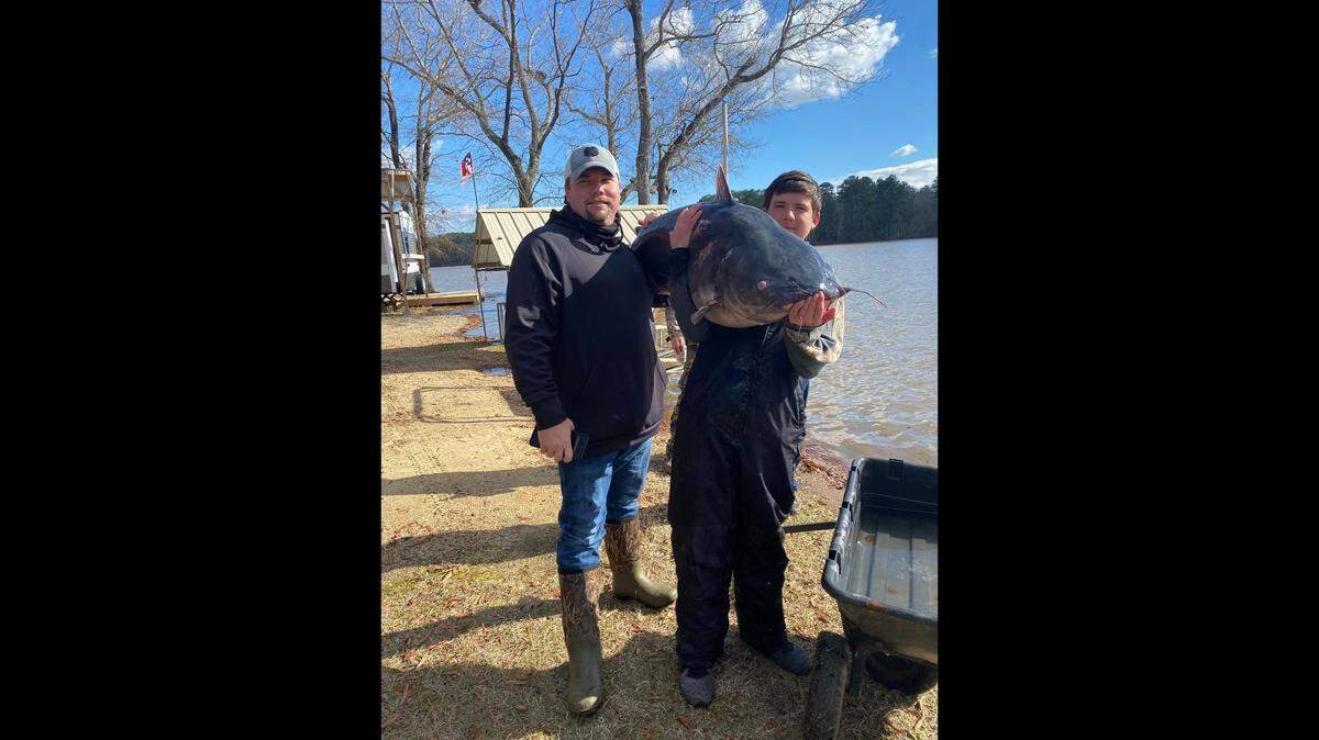 Ryan Williams, left, and his nephew Destin Fox, right, both of Rock Hill, South Carolina, with a 94-pound blue catfish caught Dec. 30, 2023, in Lake Wateree.
