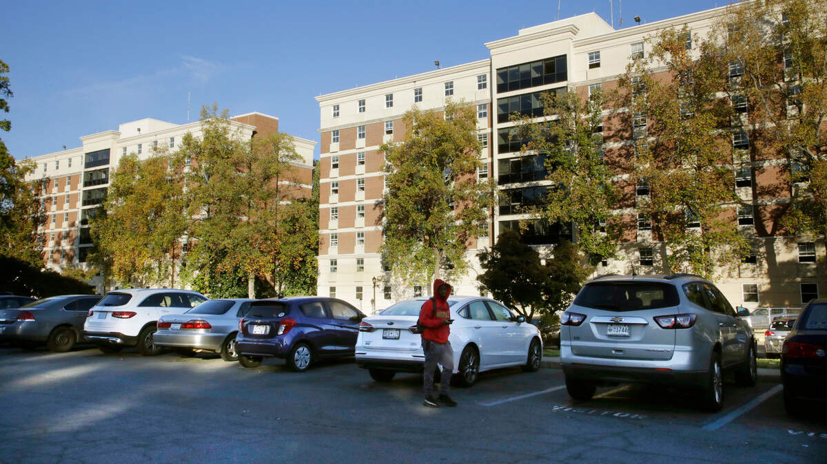 A Winthrop Universiity student walks by Wofford and Richardson halls Monday. Both buildings will be demolished by early 2024.