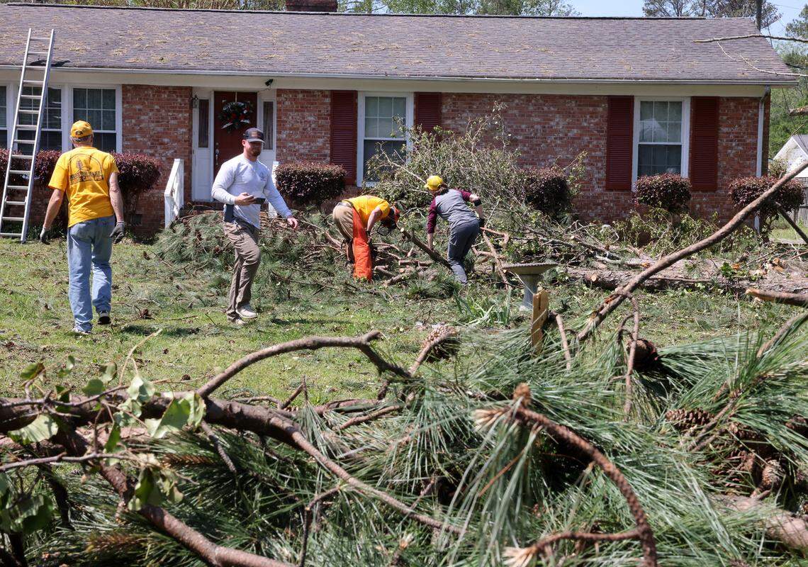 Volunteers with the South Carolina Baptist Convention Disaster Relief group helped clean up a yard on Post Lane after last year's hail storm in Rock Hill.