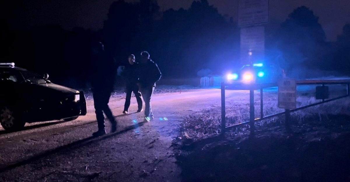 Law enforcement officials patrol the area Friday night where a plane crashed in Rock Hill.