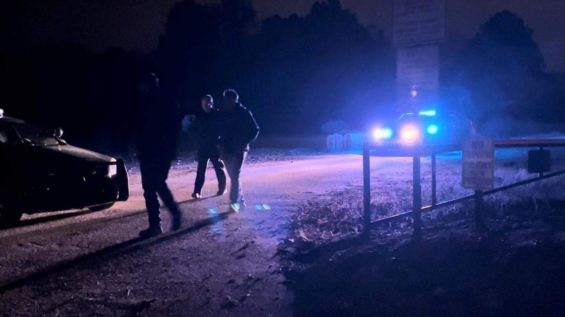 Law enforcement officials patrol the area Friday night where a plane crashed in Rock Hill.