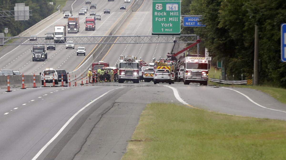 Emergency crews work to clear a multi-vehicle crash near the Sutton Road exit on I-77 in Fort Mill Friday morning.
