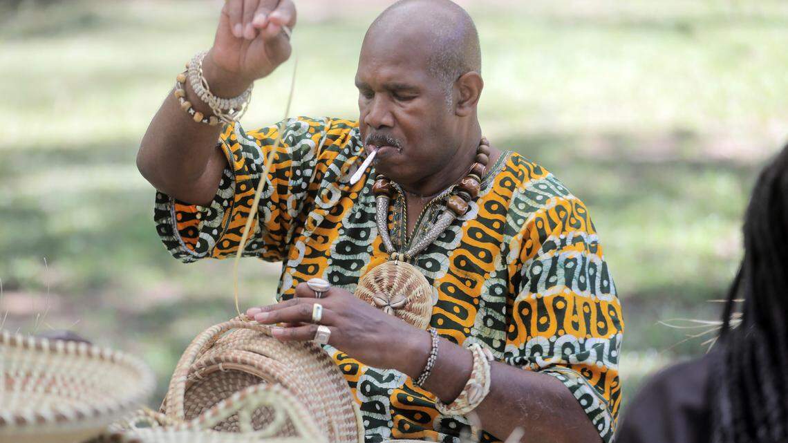 Michael Smalls of Gullah Sweetgrass Baskets Creations makes a basket Saturday at Vivian Ayers’ ”Workshops in Open Fields” at Brainerd Institute in Chester.