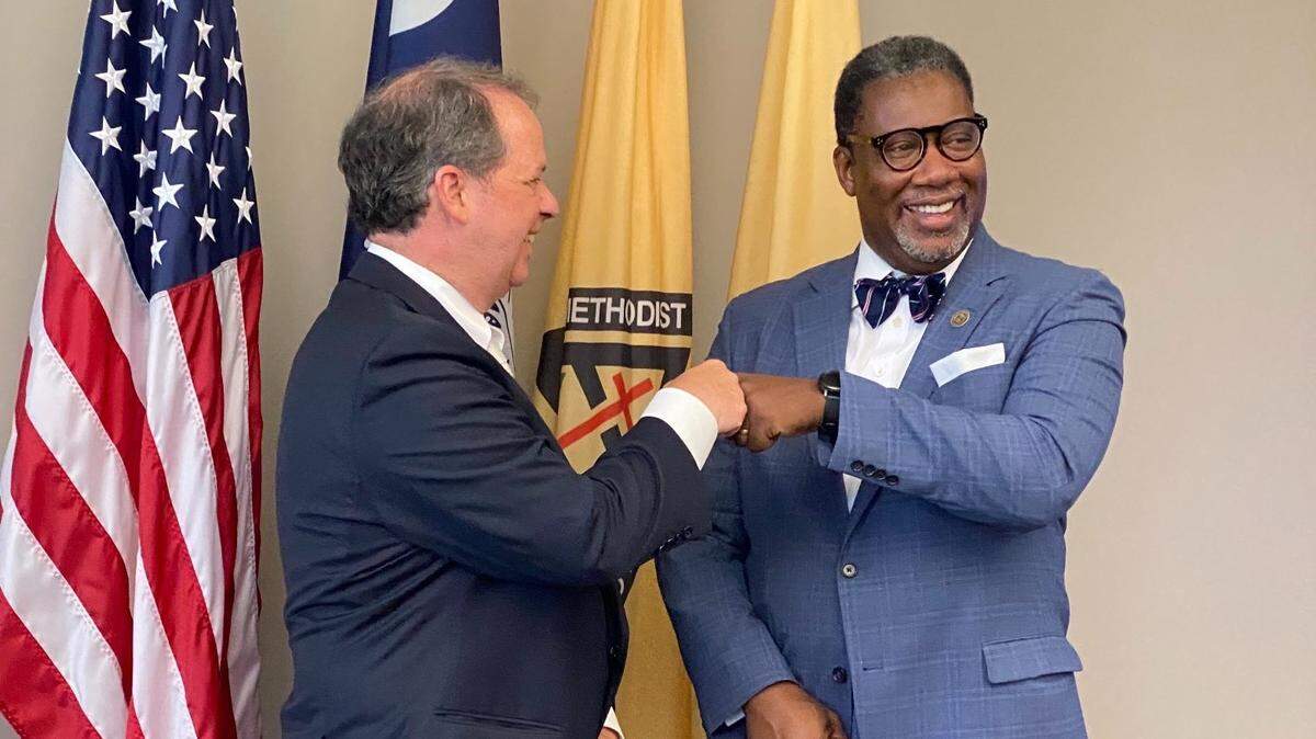 Rock Hill Mayor John Gettys and Clinton College President Rev. Lester A. McCorn celebrate after being awarded $3.5 million grant.