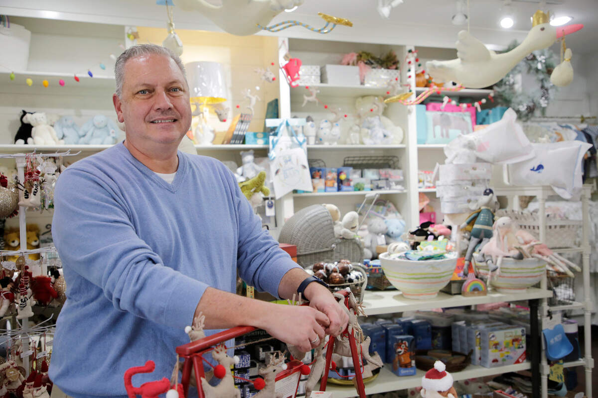 Keith Suttles, owner of Crossings on Main in Fort Mill, stands in his shop on Academy Street.