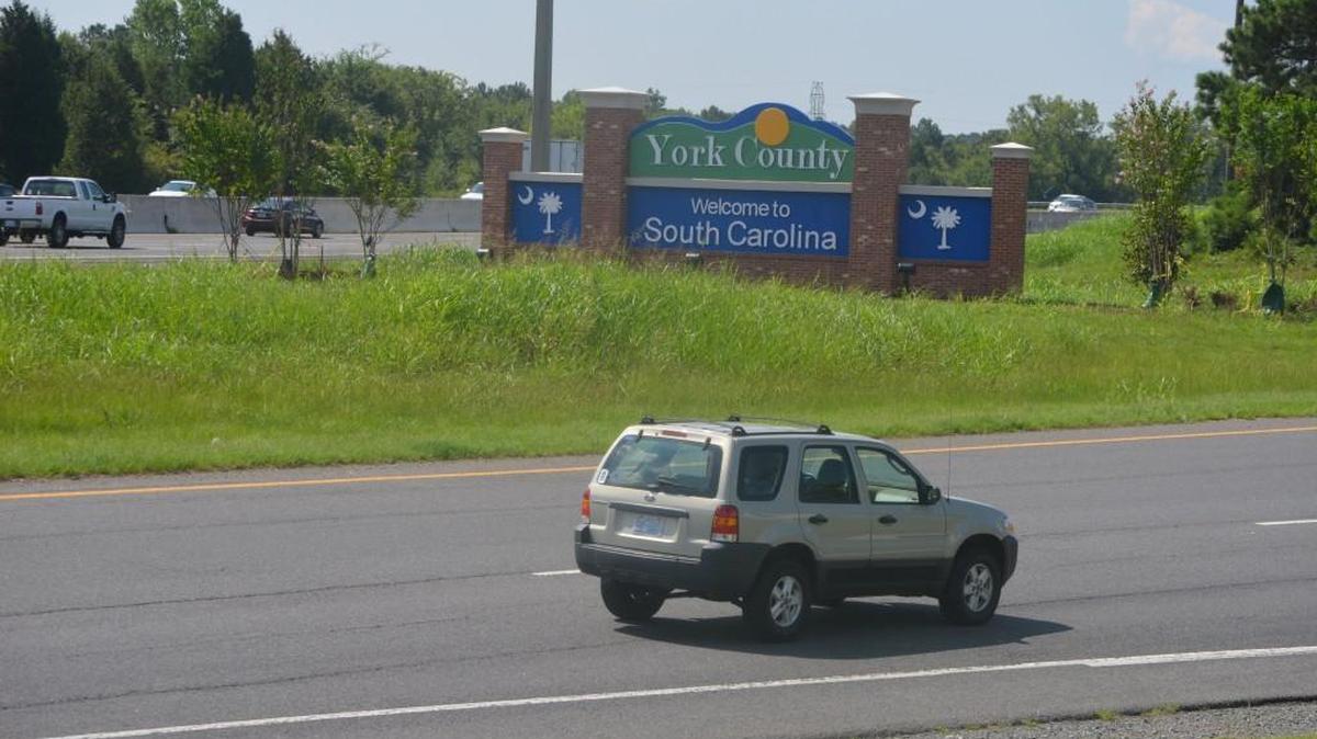 A sign welcomes motorists to York County at the Carowinds Boulevard exit off Interstate 77.