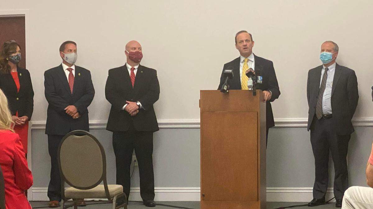 Sheriff Max Dorsey and Chief Prosecutor Creighton Waters stand behind South Carolina Attorney General Alan Wilson as he addresses the room. “It’s as big of a trafficking case as you can have,” Waters said at the press conference.