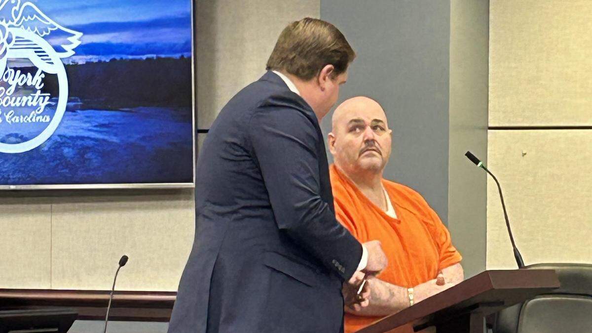 Former police officer Charles Eugene “Chuck” Price, right, listens to his lawyer, Ben Hasty, during York County, South Carolina, court on Jan. 8, 2026. Price is now serving a total of 40 years prison for child sex crimes.