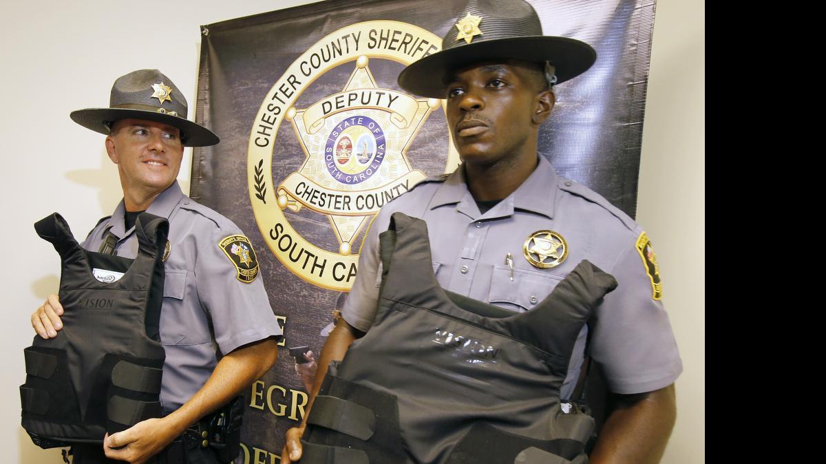 
Chester County sheriff's deputies show off their new bulletproof vests that were bought with donations from the public. Lt. John Kelly, left, and Deputy Cedric Dunn show their new bulletproof vests. 

