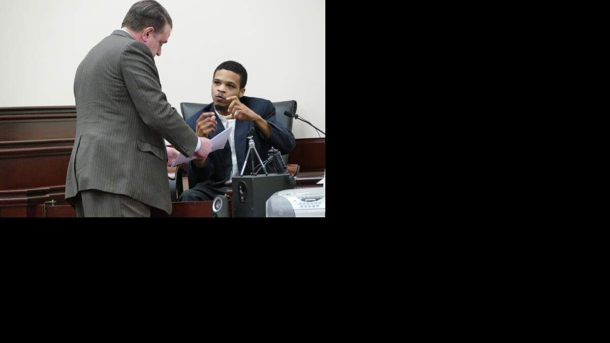 
While on the stand Thursday, Quentin Evans explains to 16th Circuit Solicitor Kevin Brackett how the photos on his phone smoking marijuana were not taken while he was watching his 6-week-old daughter, Kaidence, who died in his care.
