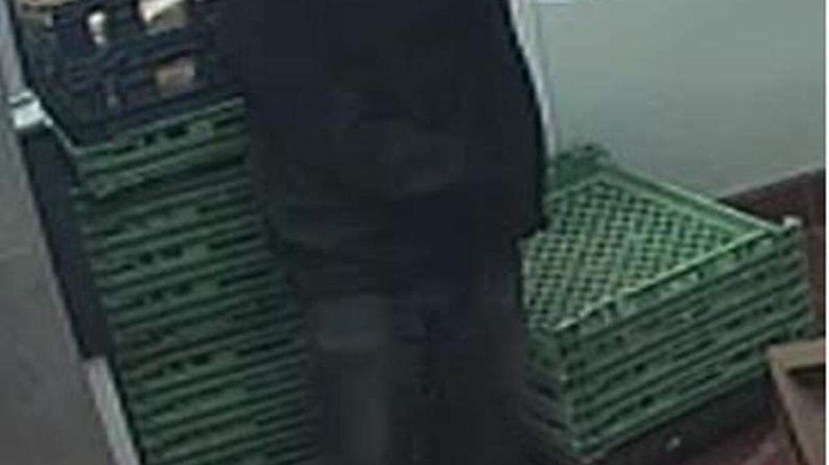 A surveillance image of one of the two masked suspects who robbed a Fort Mill Burger King at gunpoint early Wednesday.