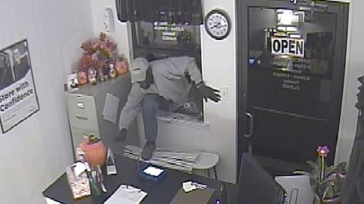 Screen shot from surveillance video showing a man breaking into the Cube Smart Self Storage on East Main Street in Rock Hill.