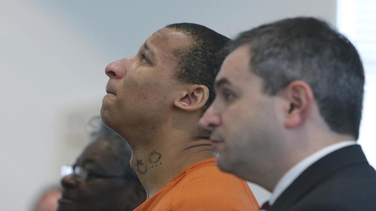 
Marqueas Buchanan, now 20, was charged with murder in the 2013 murder for hire of Jimmie Paul sentenced to 30 years in prison in court in Chester. Paul's grandson Clayton Watts already pleaded guilty in April and was also sentenced to 30 years. Marqueas Buchanan reacts as his pastor the Rev. Brenda Pemberton speaks in court. Buchanan's lawyer Gary Lemel listens.
