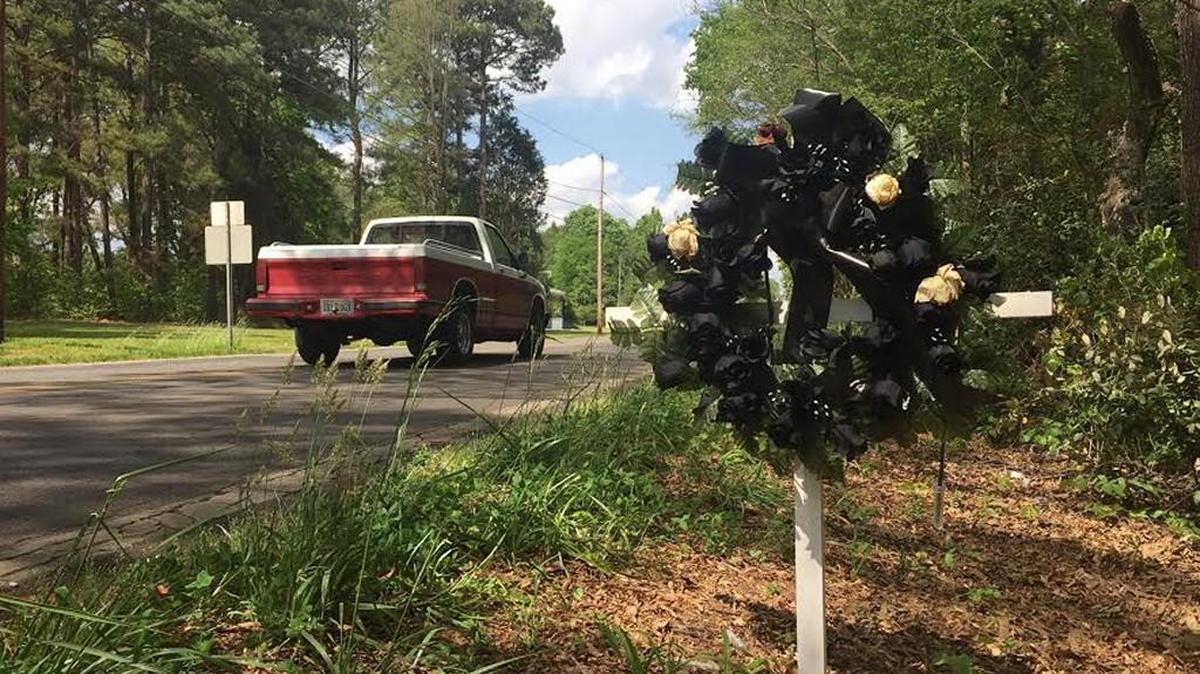 A cross and wreath mark the spot on Lincoln Road in York where Carlos Madriaga, 77,was fatally struck by a school bus two weeks ago. Prosecutors announced Thursday they will not file charges against the driver.