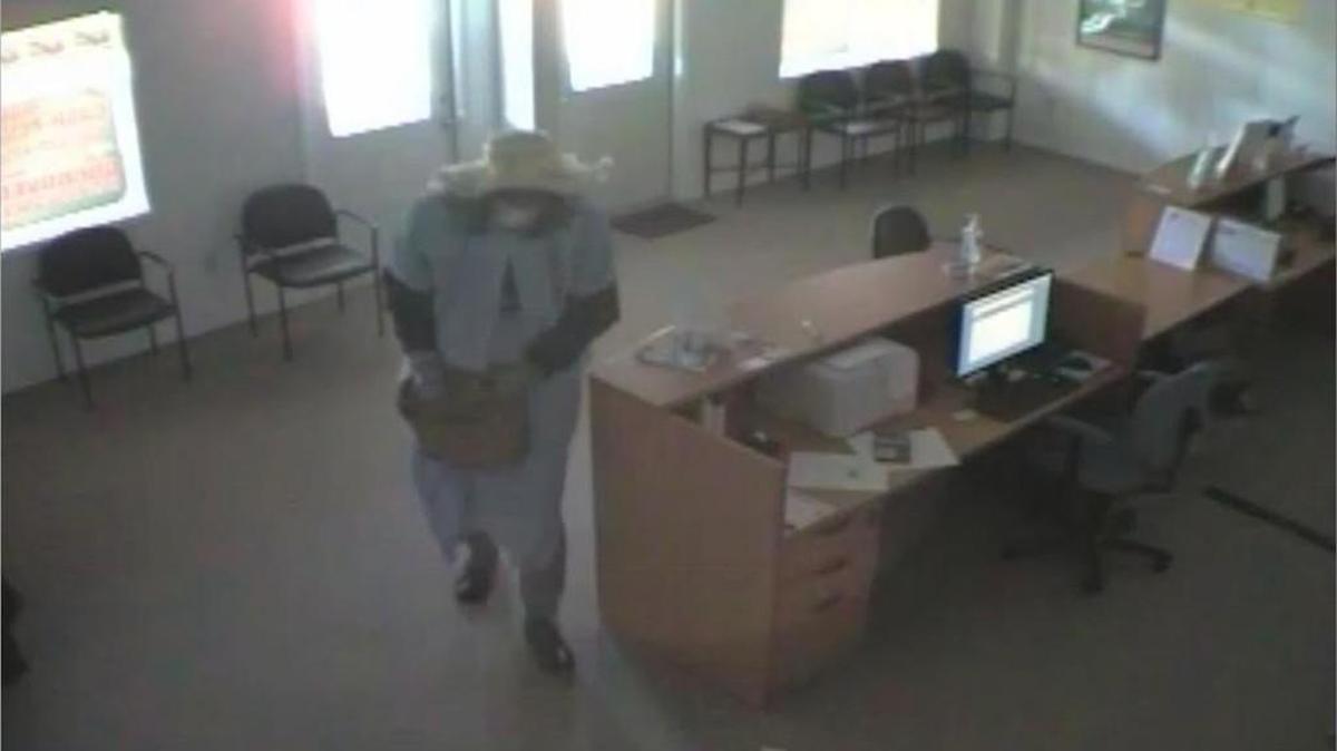 Clover police are searching for a man who was wearing a dress and wig when he robbed a business at gunpoint Saturday morning.