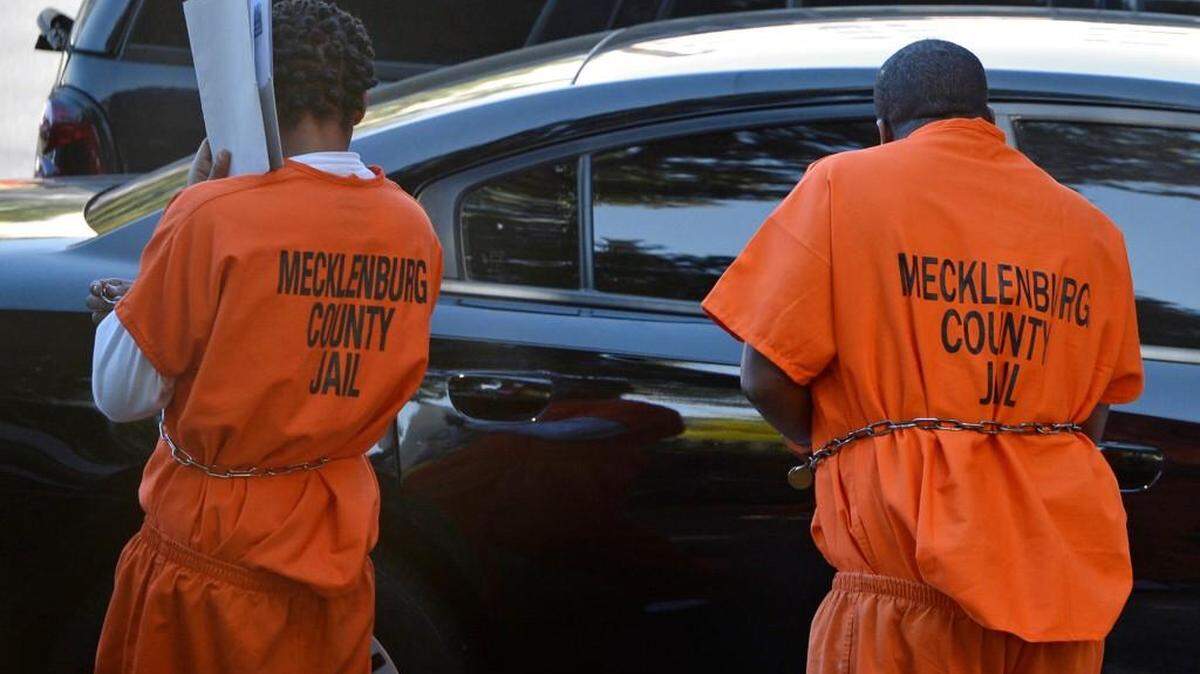 Rahkeem McDonald (left) Crop out guy on right> Prisoners exit the Federal Courthouse in Charlotte where reputed gang members pleaded guilty, Tuesday, October 20, 2014, for their role in the 2014 shooting deaths of Doug and Debbie London, who prosecutors say were gunned down in their home to keep them from testifying against three United Blood Nation members.