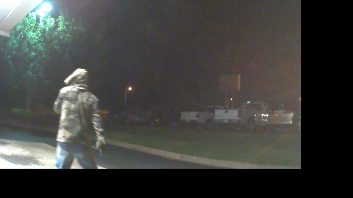 
Lancaster Police are searching for a man who tried to rob an ATM customer at gunpoint late Wednesday. The suspect, pictured, was wearing blue jeans, a camouflage jacket, gloves, sunglasses and had his face covered. 

