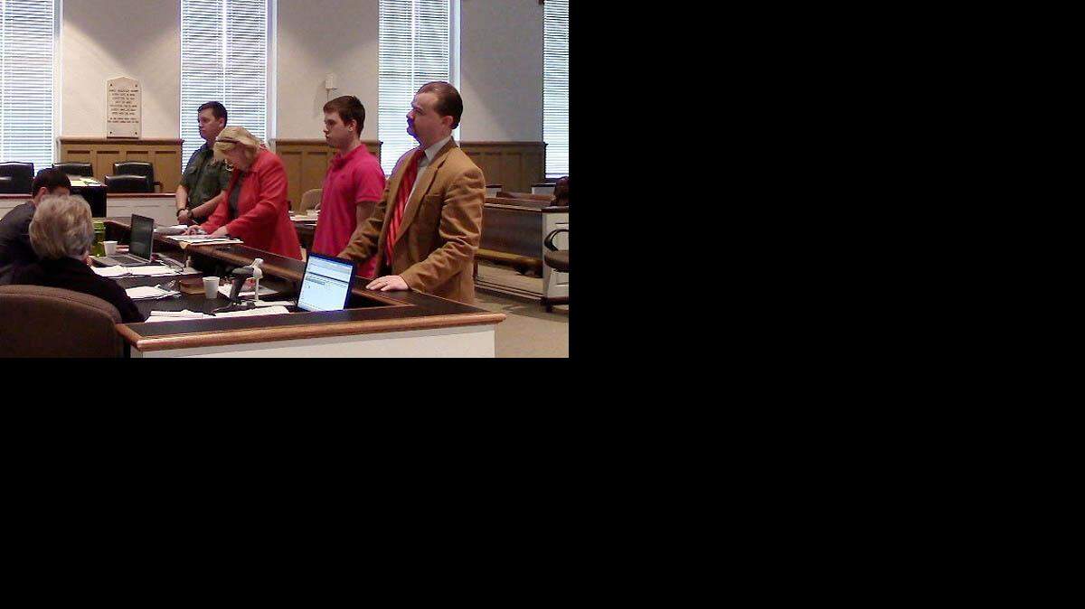 
Robert Land, 18, center, appears in court to plead guilty to shooting a deer at night.
