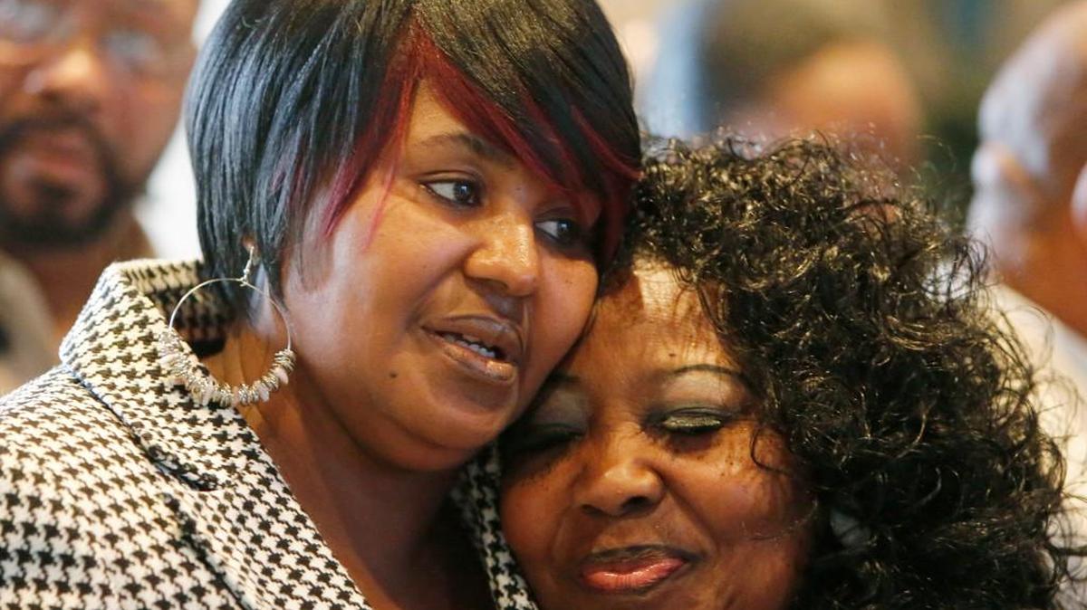 Laverne McGriff, left, is comforted by Apostle Mamie Wilson of the Resurrection of Life Church in Lancaster on Tuesday after the National Action Network announced its new chapter.