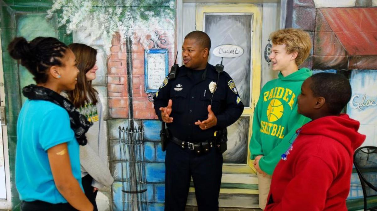 At Rawlinson Road Middle School, Rock Hill Police Officer Keenan McCrorey talks with students. Spring Valley prompted more discussion.