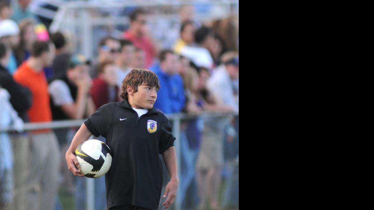 
Adam Smith, the Northwestern soccer team manager, walks the sidelines during the Upperstate Championship game in 2009.

