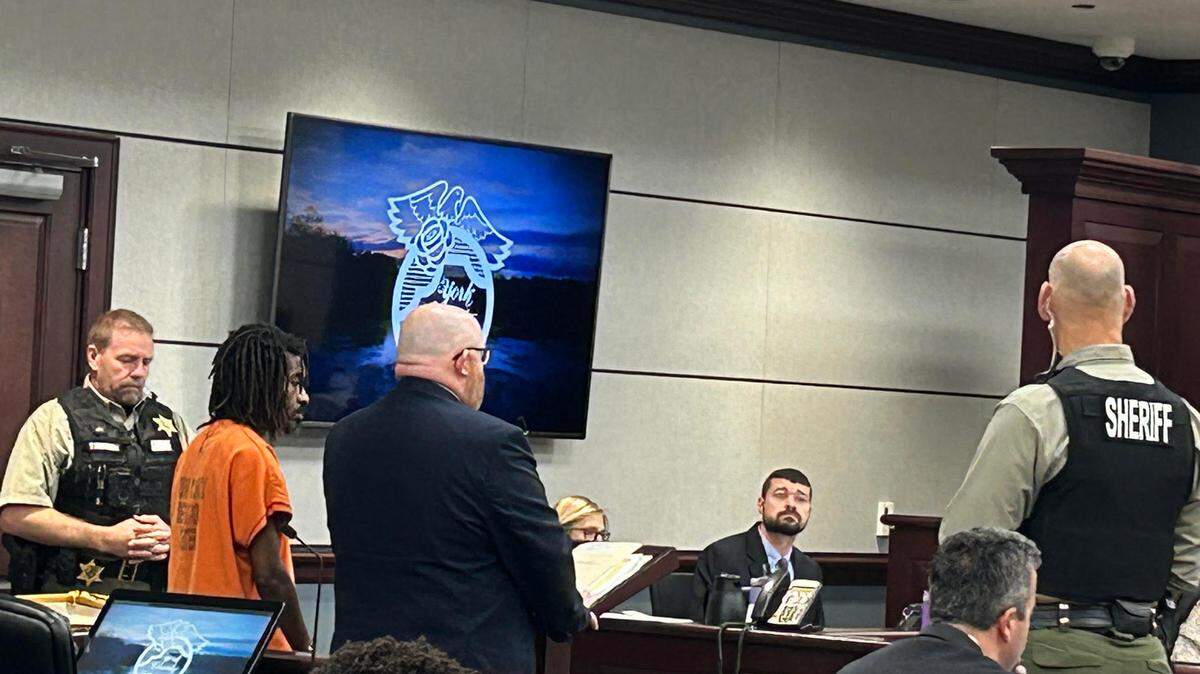 David Herbert Massie, second from left in orange, in York County, South Carolina court on Feb. 1, 2024. Prosecutors say Massie, 45, was caught by Rock Hill police after a November 2023 bank robbery by a GPS tracker in the moneybag.