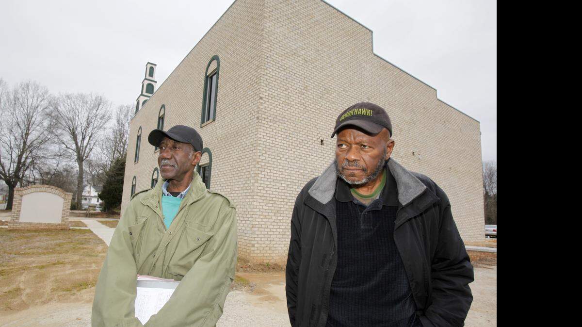 
FILE. James Jumah Moore, left, Director of the Islamic Center of South Carolina and Jasiri Makadara spokesperson for the Islamic Center in front of the mosque on West Main Street in Rock Hill.
