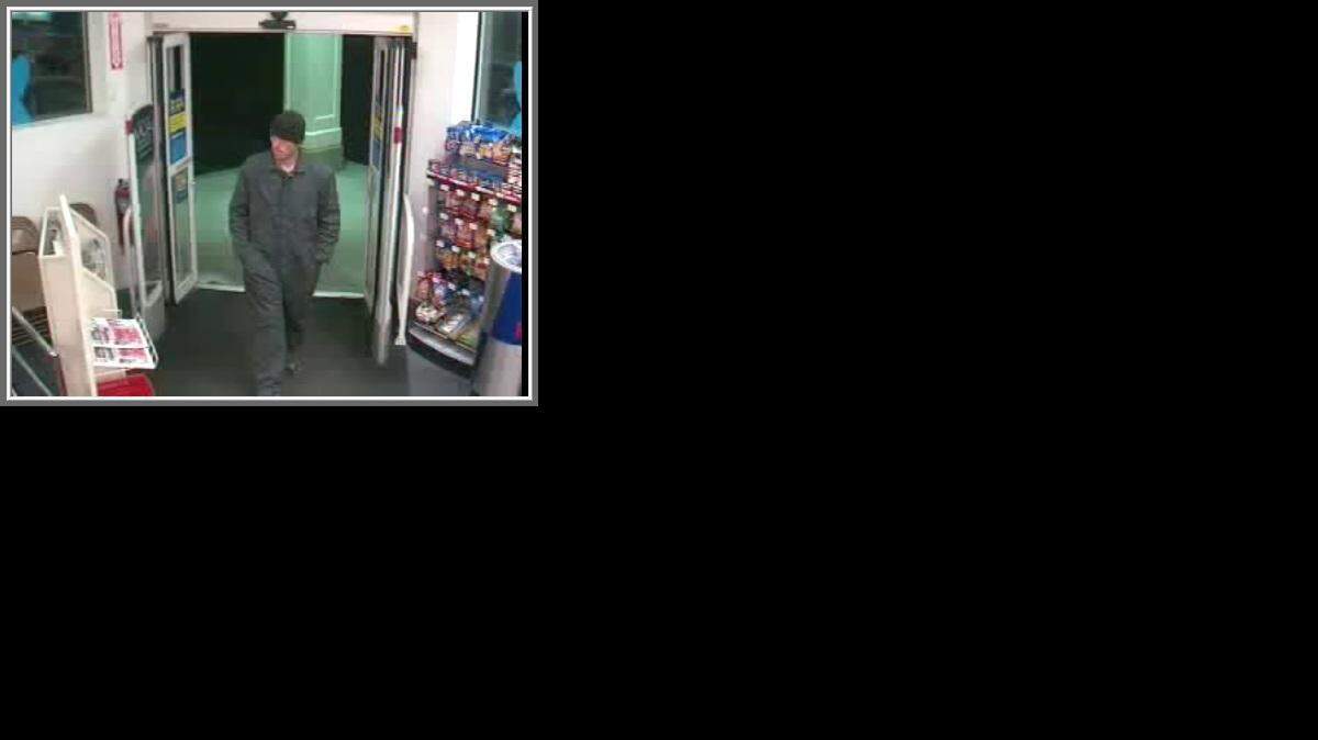 
Surveillance photos show a suspect entering the CVS.
