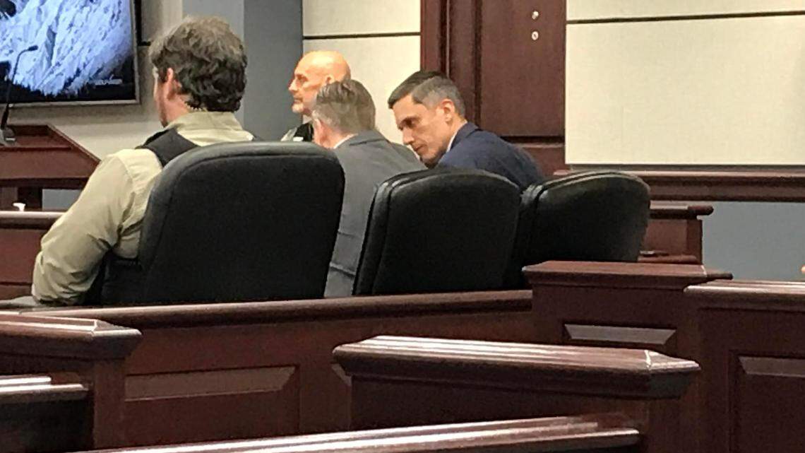 Augustus Sol Invictus, right, a former U.S. Senate candidate in Florida, confers with his lawyer B.J. Barrowclough in court Monday in York County, S.C. where he is accused of domestic violence.