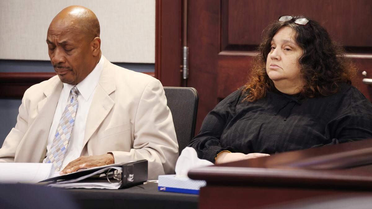 Stacy Michelle Rabon sits with a member of her defense team Tuesday in Court at the Moss Justice Center. Rabon is charged in the death of her infant daughter in 1992.