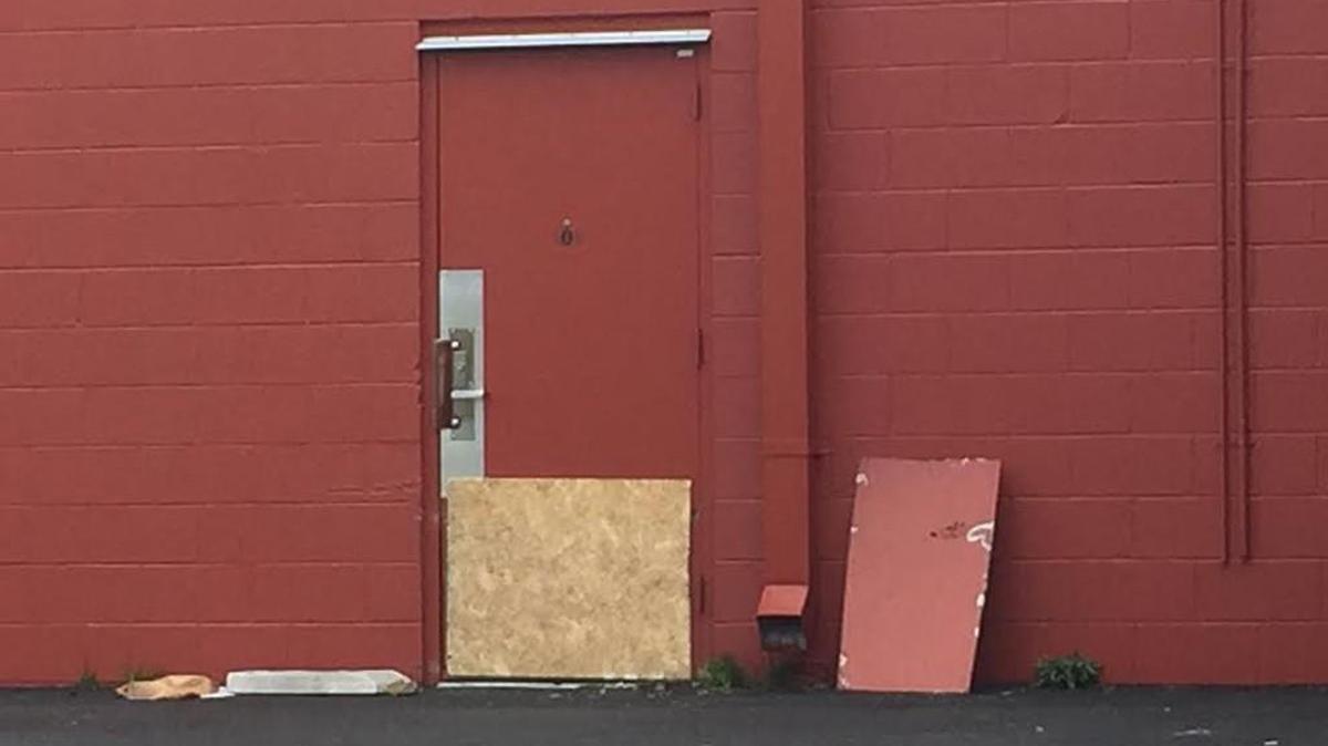 Thieves cut through a metal rear door at the T-Mobile on Cherry Road early Tuesday. They fled after taking about four-dozen iPhones.