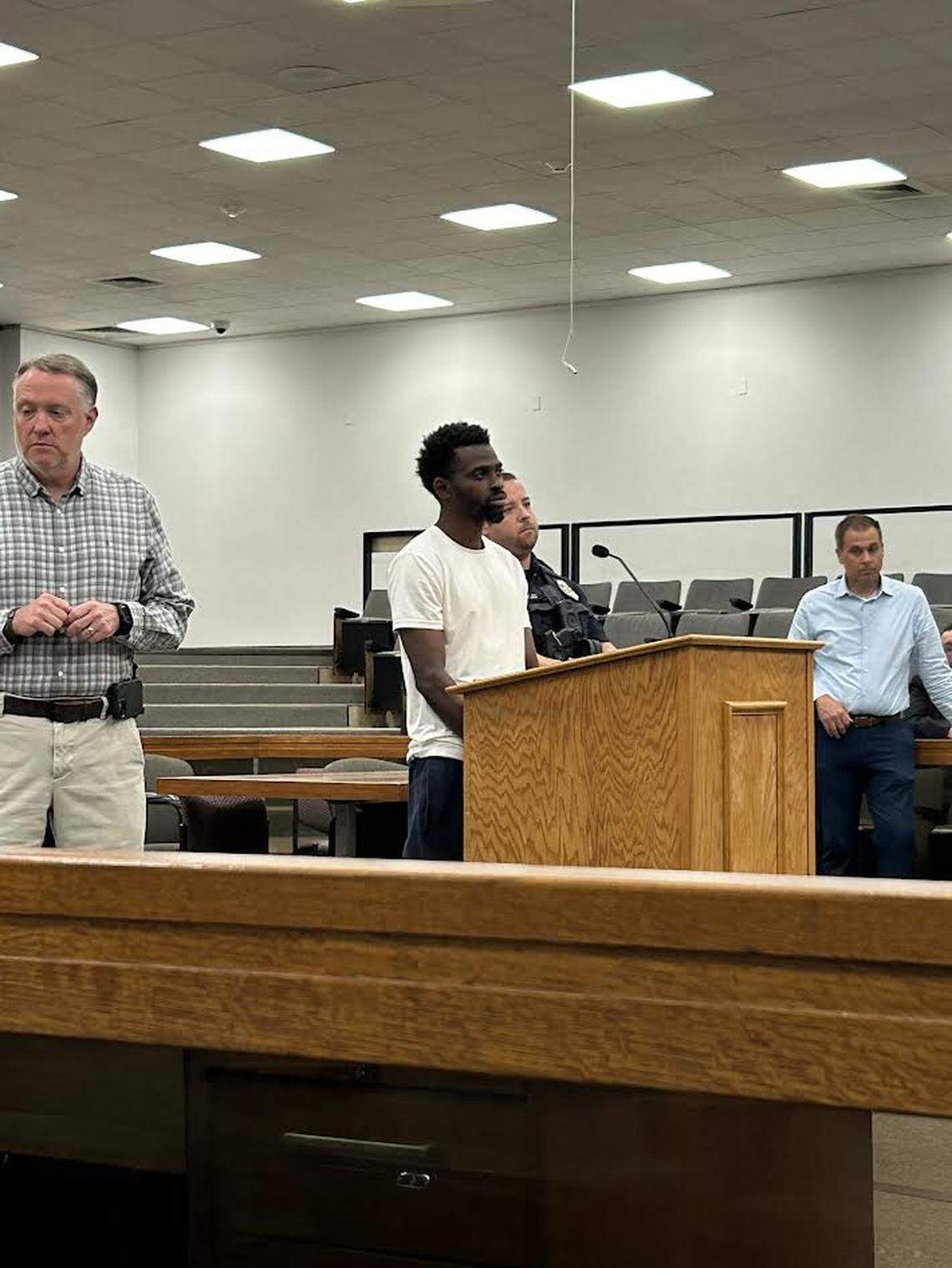 D’Aaron Boyd Colston, center, is surrounded by Rock Hill police officers in court on April 23, 2026, after his arrest for murder.
