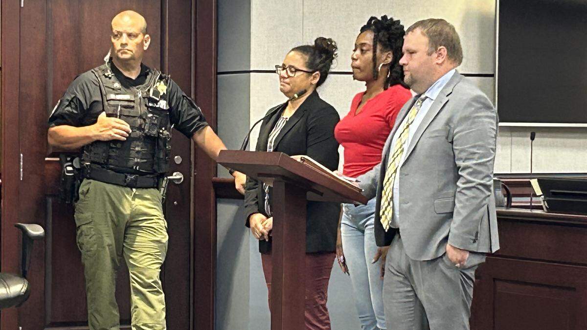 Brittney Nicole Reed, second from right, stands with her lawyers in York County criminal court on Sept. 18, 2025. She pleaded guilty to first-degree assault and battery.