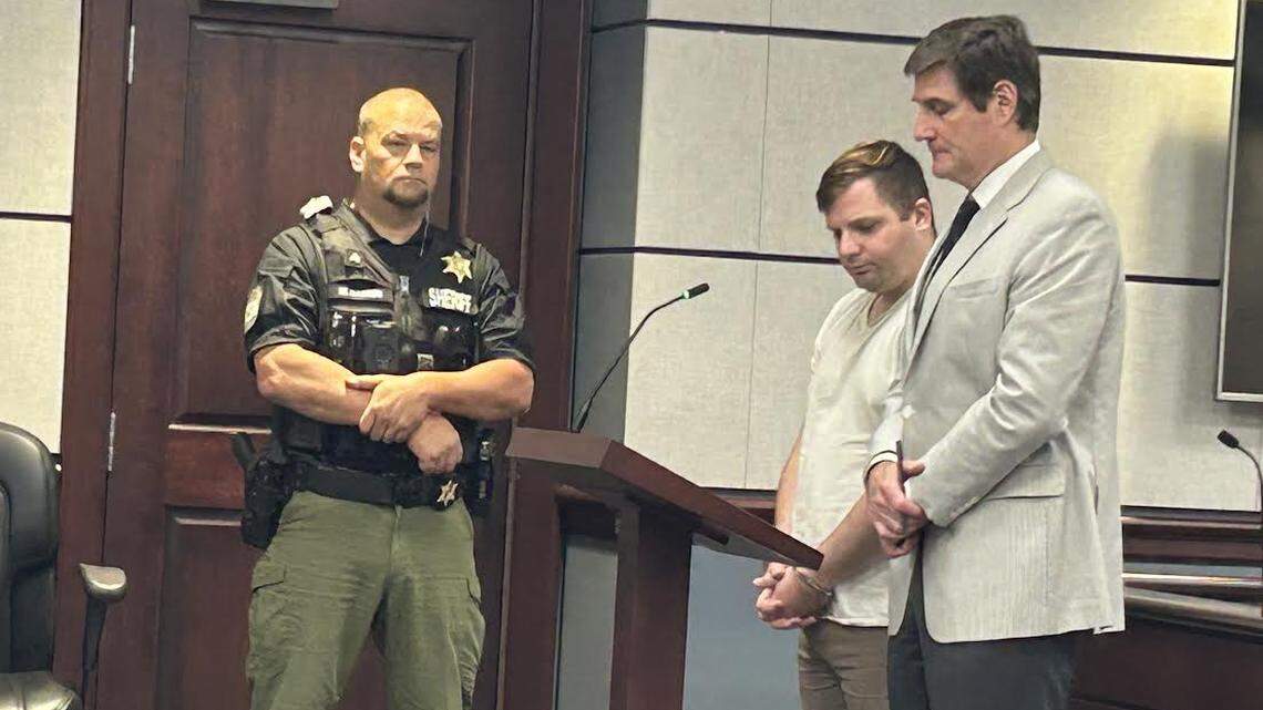 Erickson Lee, center, in court Friday Sept. 6, 2024. Lee, a former North Carolina police officer, was sentenced to nine years prison for child sex crimes while a volunteer at a Fort Mill, South Carolina church.