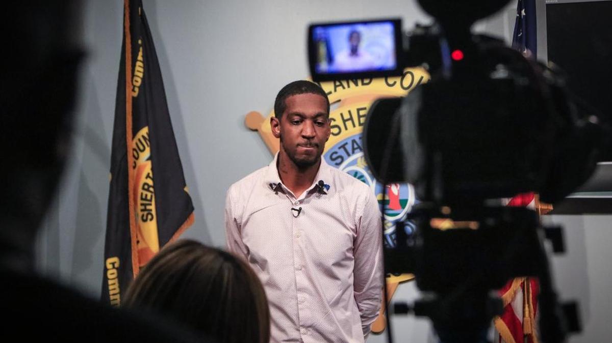 Alvin Posey and Kimberly Posey hold a news conference Monday to plead for help in finding the killer of their brother, Marcus Posey. He was shot while walking home May 21.