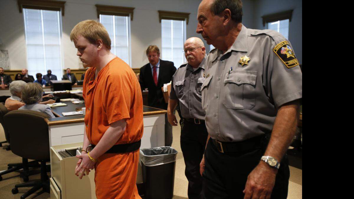 
Clayton Eli Watts pleaded guilty to murder Wednesday in connection with the 2013 murder-for-hire plot that resulted in the shooting death of his grandmother. Watts is escorted from the courtroom after the guilty plea.
