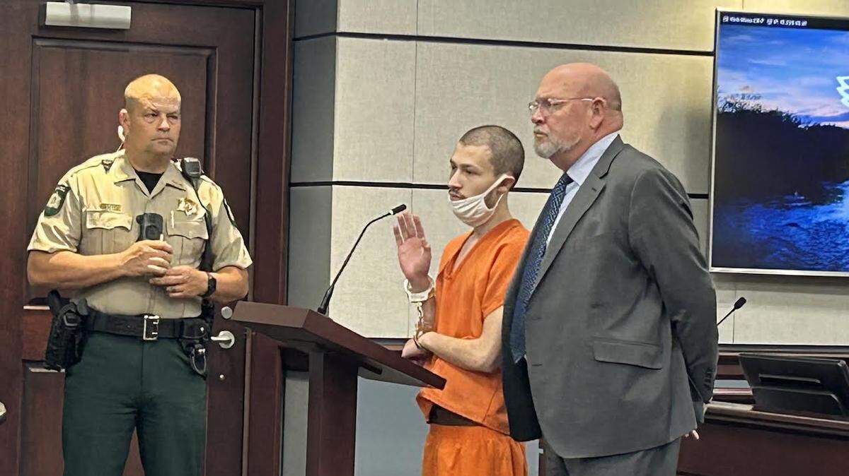 Noah Immanuel Walter, middle in orange, in York County court on Dec. 18, 2025, with his lawyer, Leland Greeley.