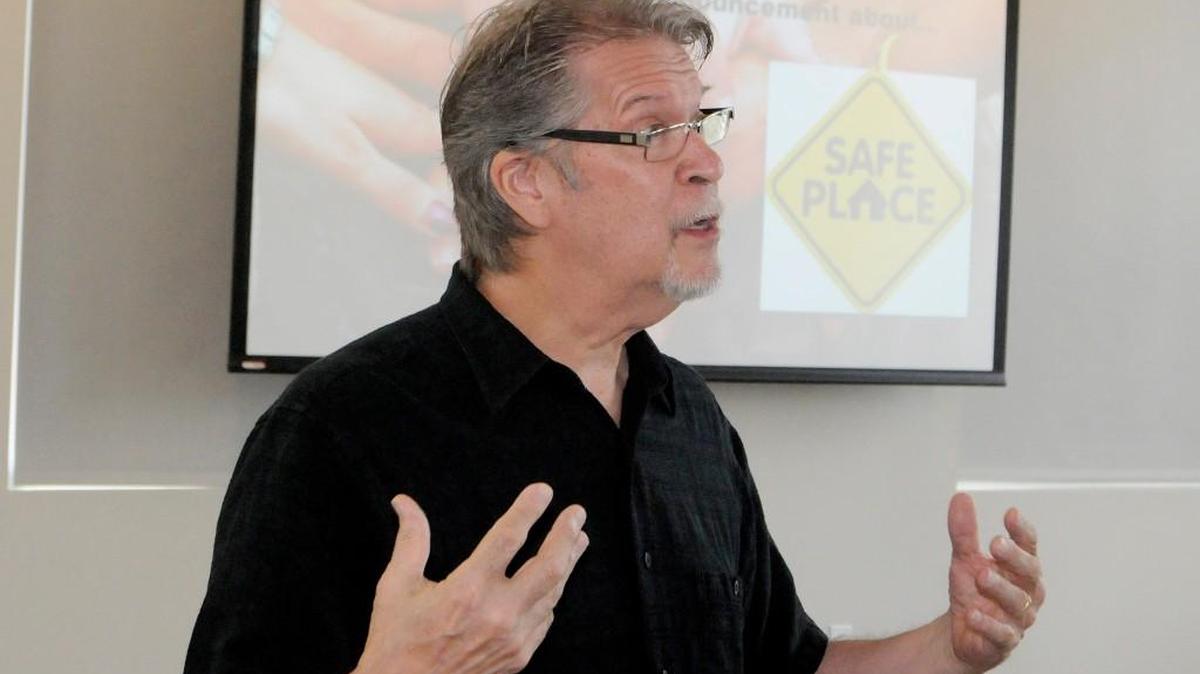 Bruce McKagan, executive director of Renew Our Community, talks to leaders Wednesday about plans for Safe Place in York County. The Safe Place sign can be seen in the background.