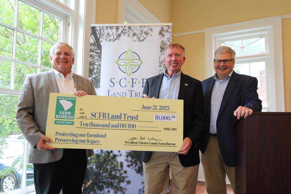 South Carolina Farm Bureau launched its Land Trust Wednesday at an event in Lowrys. The Land Trust will focus specifically on working farms, ranches and forestlands. Rusty Darby, State Board Director for Chester County presented a $10,000 check on behalf of the county to aid in funding the Land Trust. Ott said the money will help with the daily operations of the Land Trust. (From L to R: Harry Ott, SCFB President; Rusty Darby, Chester County State Board Director; Gary Spires, SCFB Executive Director.)