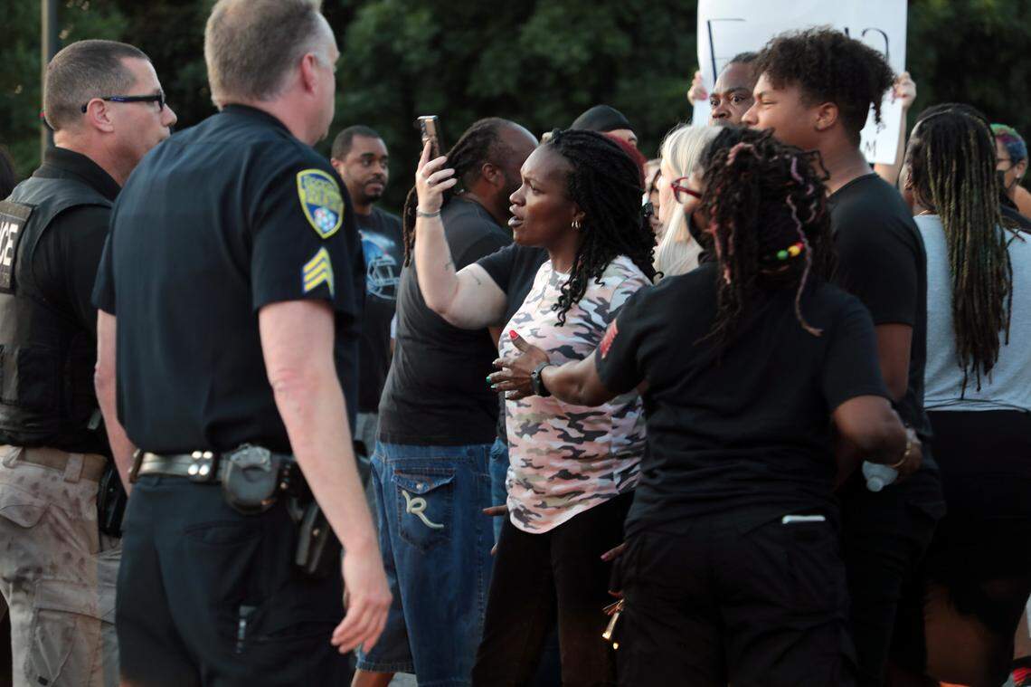 A protester confronts police officers in June 2021 in downtown Rock Hill.