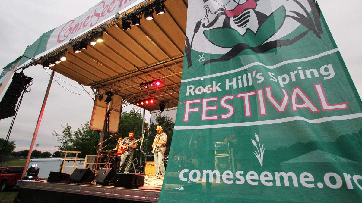 A band performs on a large stage at Winthrop Lake for the Moonlight Jazz and Blues event as part of the Come-See-Me Festival.