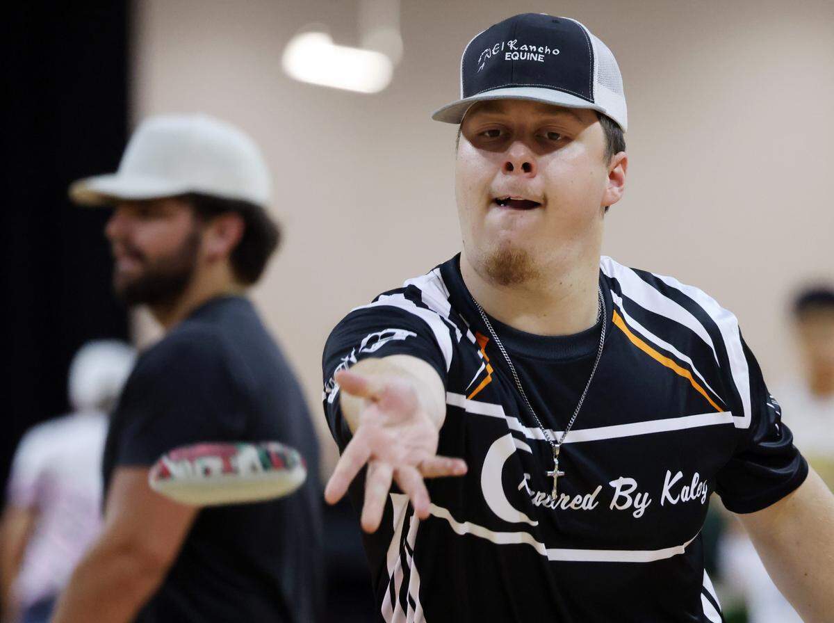 A visitor to the Rock Hill Sport and Event Center plays cornhole Friday at the American Cornhole League World Championships.