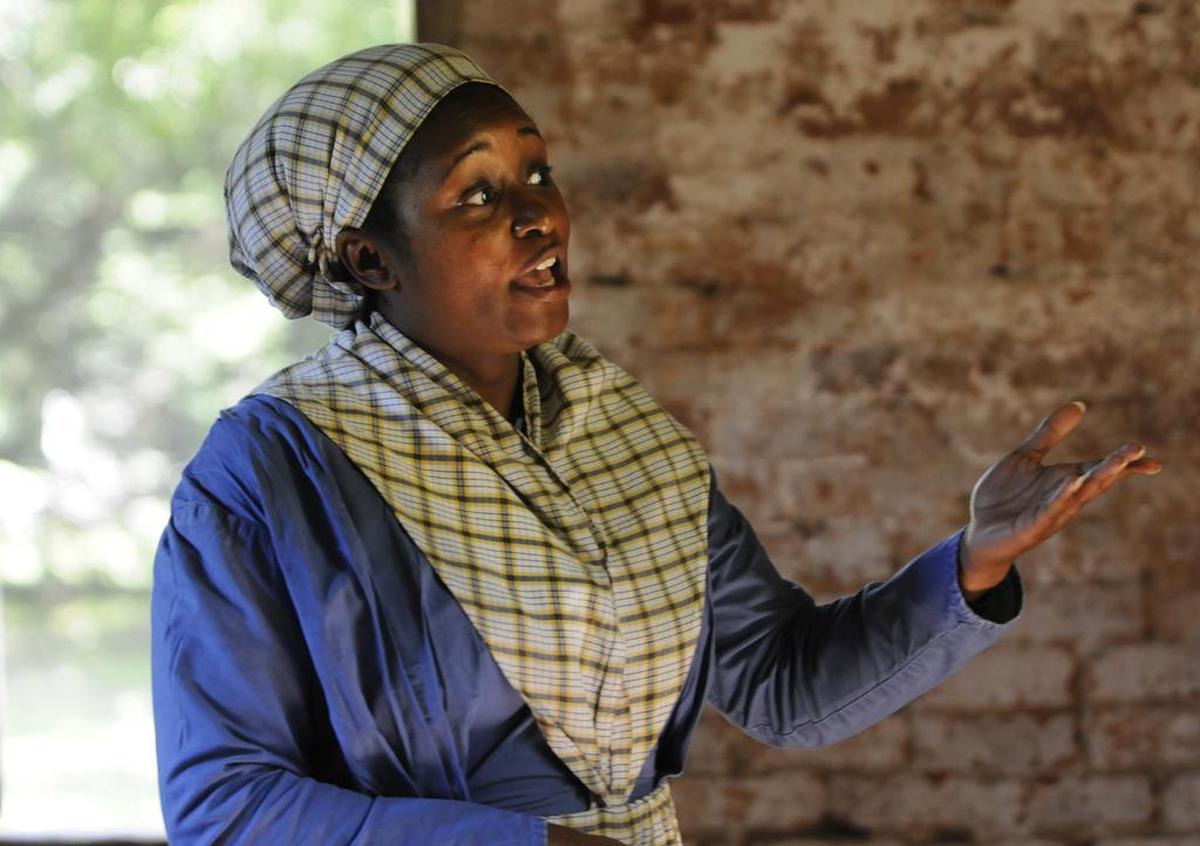Original: Sonja Burris speaks Saturday to visitors at Historic Brattonsville about life for the slaves who lived at the Revolutionary-era plantation in McConnells. The York County Culture and Heritage Museum held "By the Sweat of Our Brows" event that featured interpreters and descendants of slaves who lived at Historic Brattonsville.