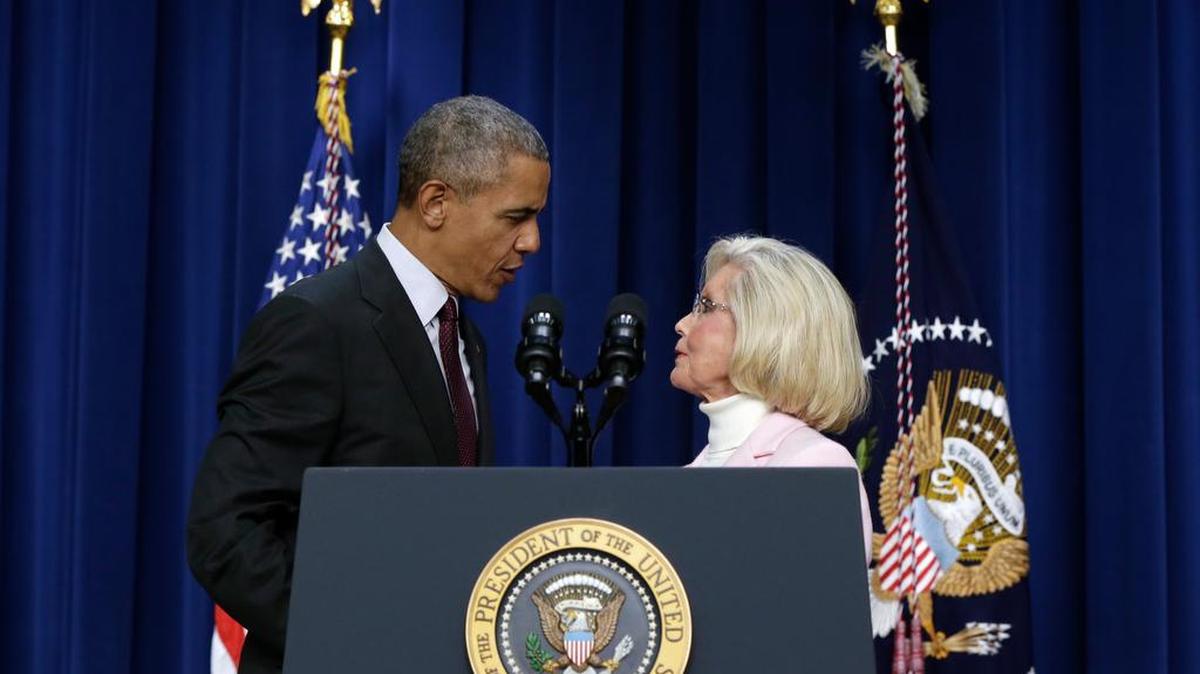President Barack Obama is greeted by women’s rights activist Lilly Ledbetter in Washington on Friday to commemorate the anniversary of the signing of the Lilly Ledbetter Fair Pay Act.