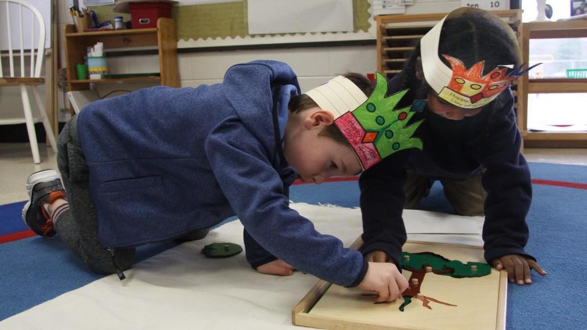Montessori students Chapman Taylor, left, and James Nixon, both 5, play with a puzzle at The Children’s School at Sylvia Circle.