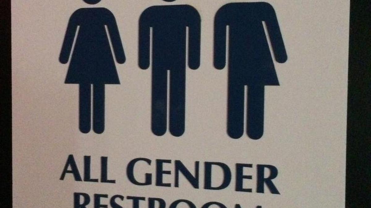 This May 11, 2014 photo shows an "All Gender Restroom" sign outside a restroom in Washington.
