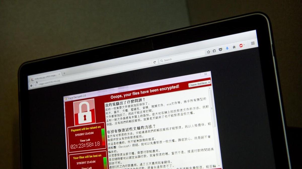 In this May 13, 2017, file photo, a screenshot of the warning screen from a purported ransomware attack, as captured by a computer user in Taiwan, is seen on a laptop in Beijing. Over the weekend, Chester County school servers were hit by ransomware but no data was stolen or breached.